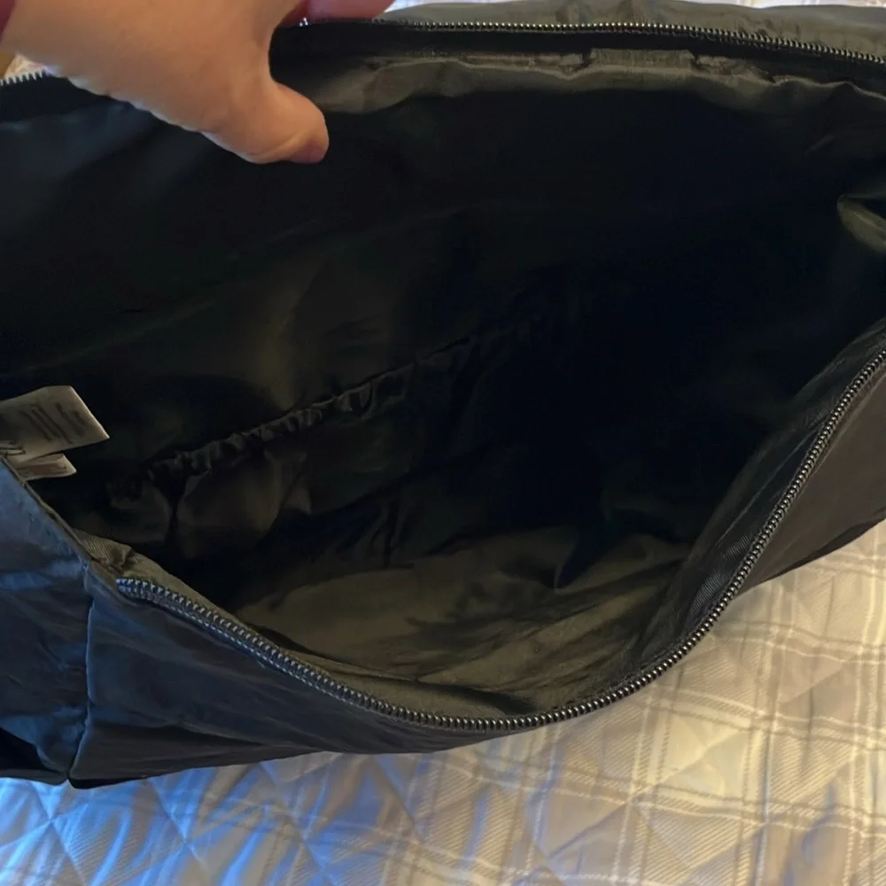 On the go backpack by Thirty-One. New in bag. Butterfly embroidered on flap